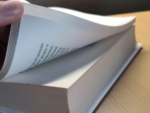  The soft rustling of pages turning