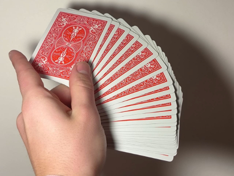 The soft shuffle of cards sliding against each other