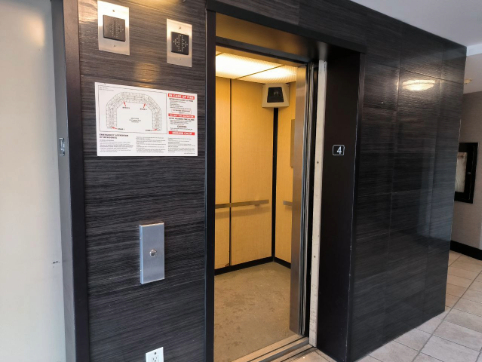 The soft ding as the elevator doors open, the mechanical hum of the lift in motion